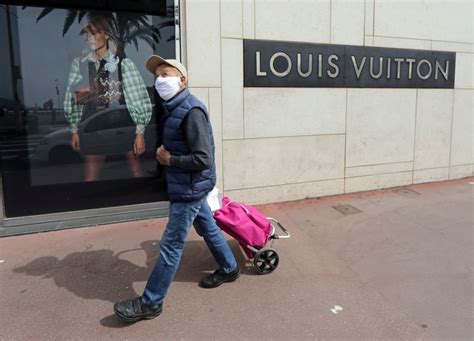 Sales drop at Vuitton owner LVMH as virus forces store closures